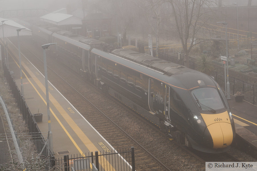 GWR Class 800 Bi-modal no. 800030 at Evesham Railway Station with Service 1P28 to London Paddington in fog.