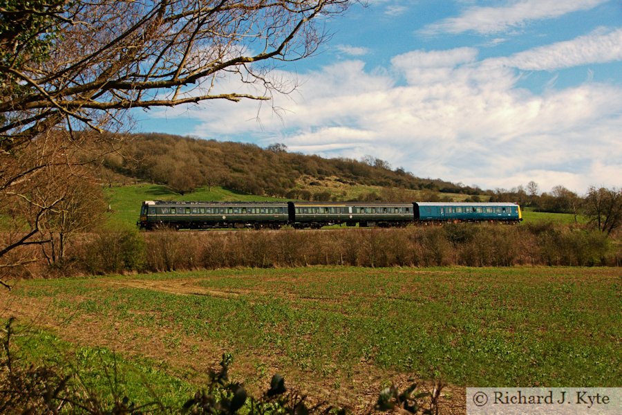 The Gloucestershire Warwickshire Railways Class 117 DMU set approaches Gotherington