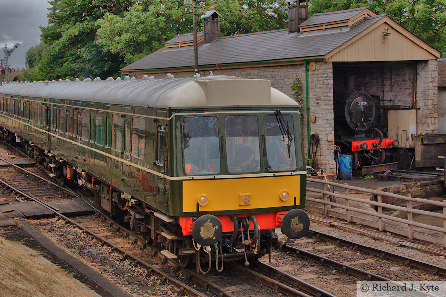 The Swanage Railway DMU passes SR T9 class no. 30120 on shed at Swanage