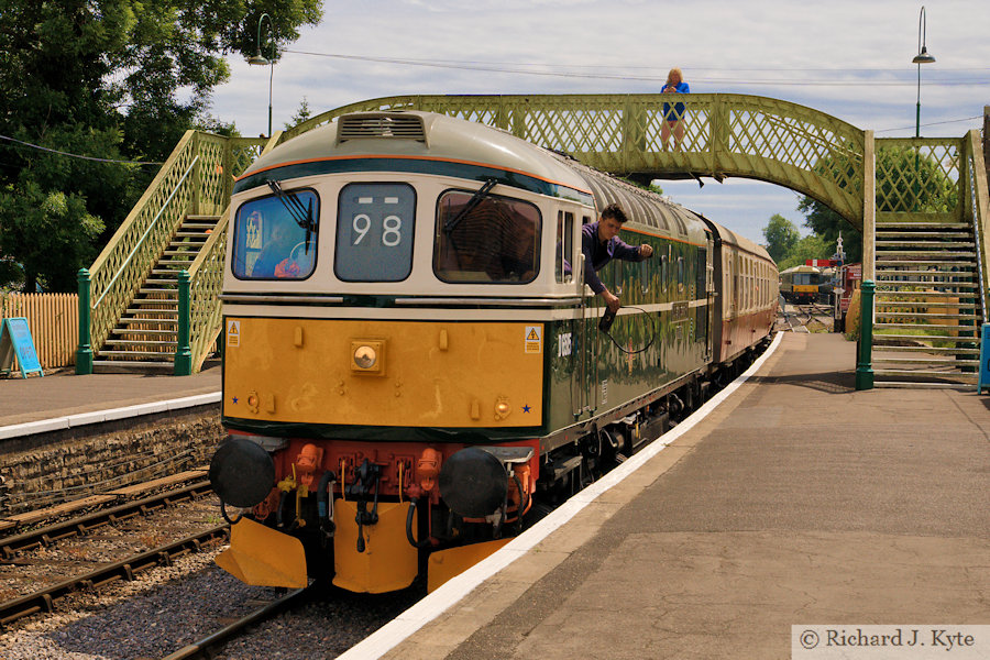Class 33 diesel no. D6515 (TOPS 33012) "Lt Jenny Lewis RN" arrives at Corfe Castle Station, bound for Norden, Swanage Railway